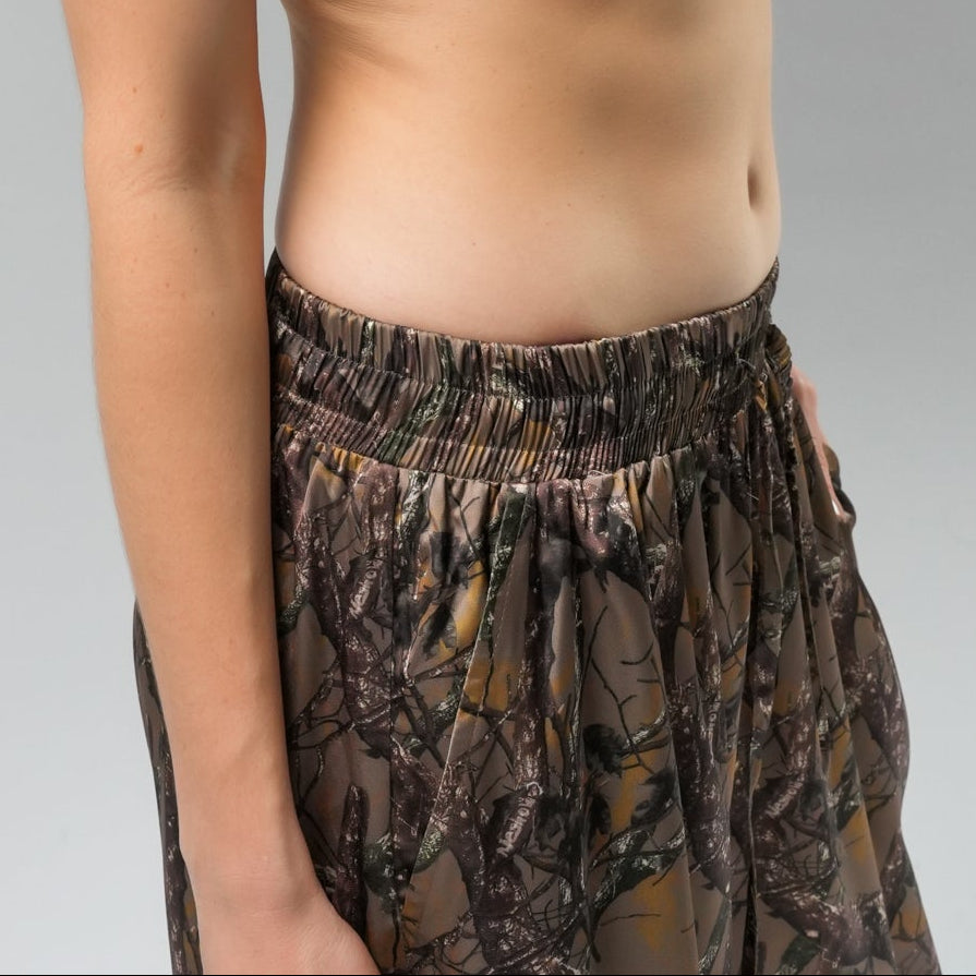 Woman wearing Camouflage pants zoomed at the waist
