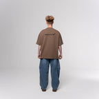 NESHOW brown oversized 320 gsm sustainable cotton t-shirt with black logo on back.