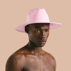 NESHOW handmade off-white straw fedora hat with a decorative band and two feathers, inspired by Mexican elegance.