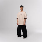 NESHOW oversized beige cotton t-shirt with random number print on front and logo on back. Sustainable 320 gsm cotton.