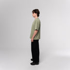 NESHOW oversized sage green 320 gsm sustainable cotton t-shirt with random number print on front and logo on back.