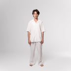 NESHOW white Bambula cotton trousers with drawstring waist and wide leg, perfect for warm weather.