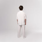 NESHOW white Bambula cotton trousers with a relaxed fit and wide leg, perfect for warm weather.