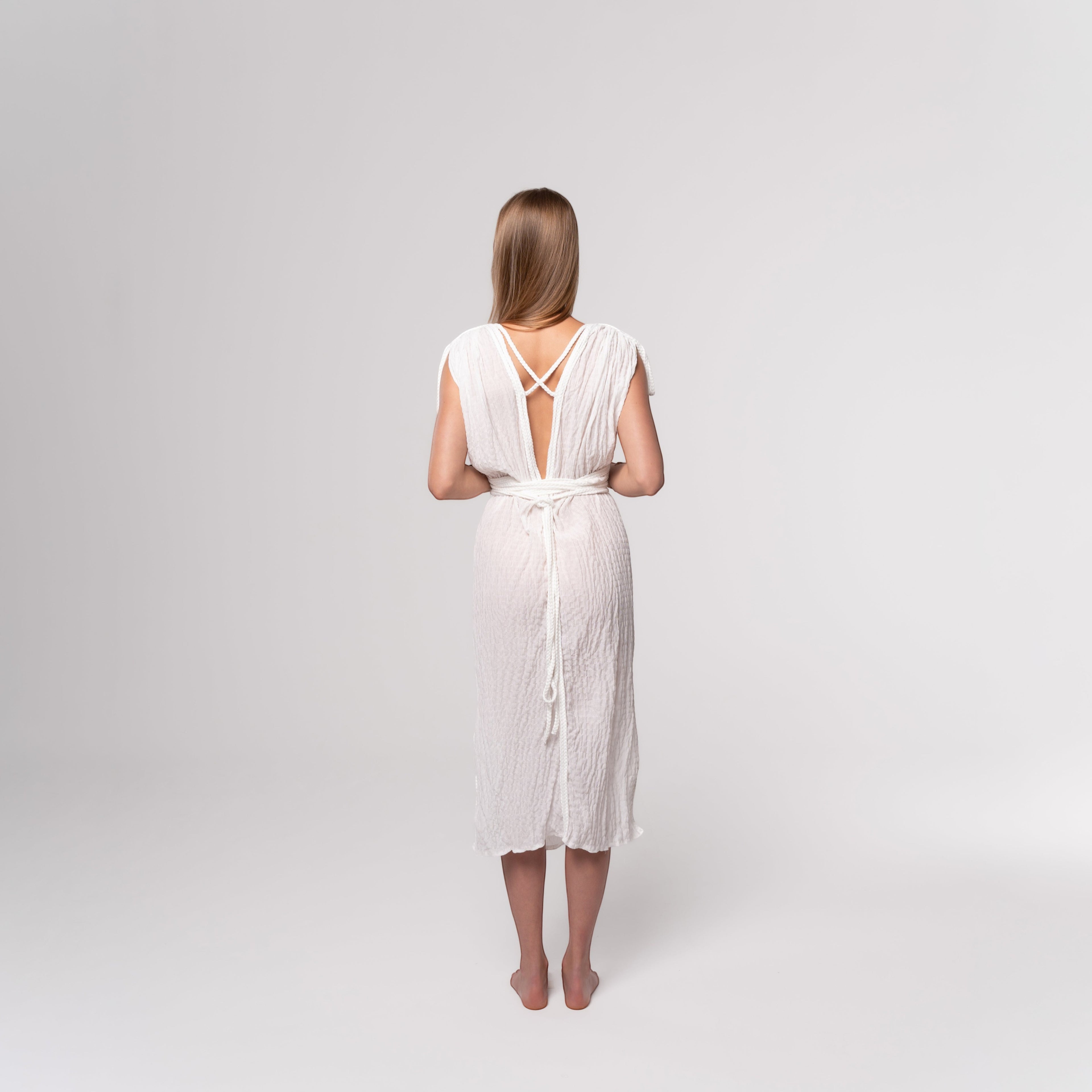 NESHOW white crinkled cotton midi dress with a deep V-back and tie waist, perfect for summer.