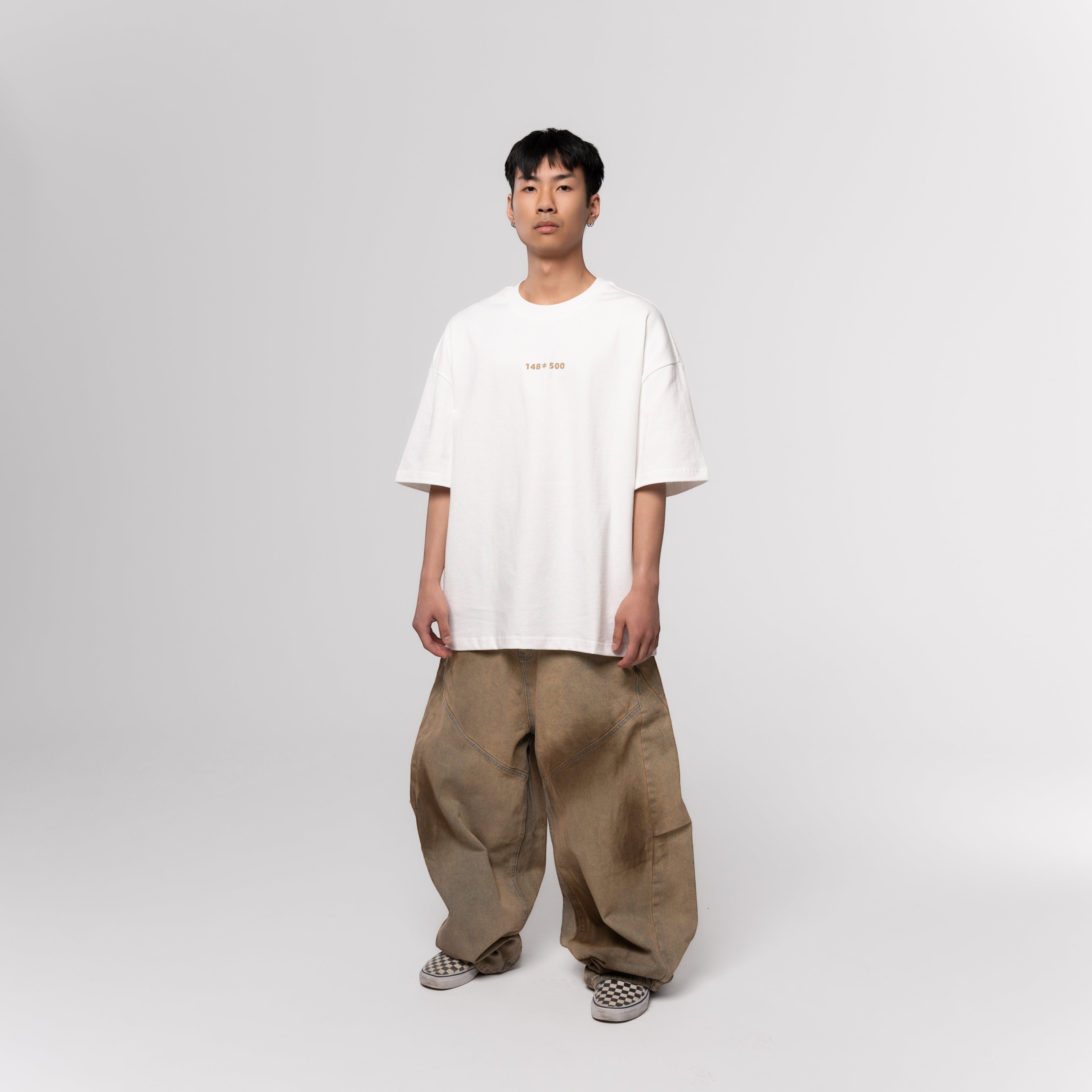 NESHOW white oversized t-shirt made from 320 gsm sustainable cotton with a random number print on the front.